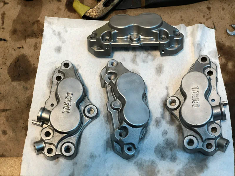 The brake calipers after vapour blasting